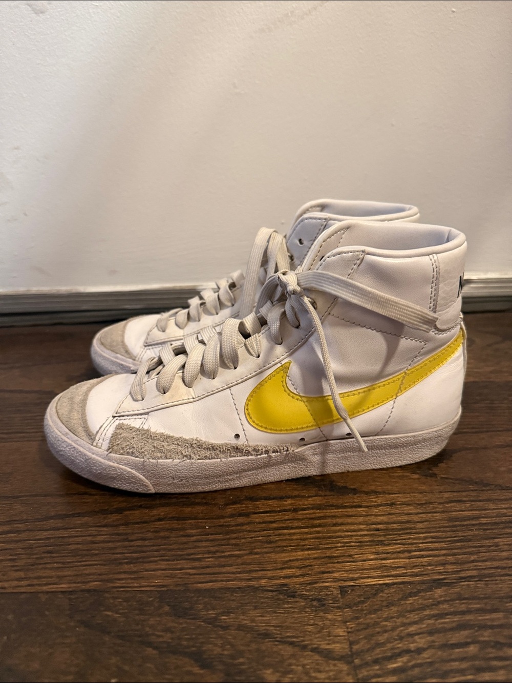 Nike High-Top Sneakers with Yellow Swoosh and White Upper